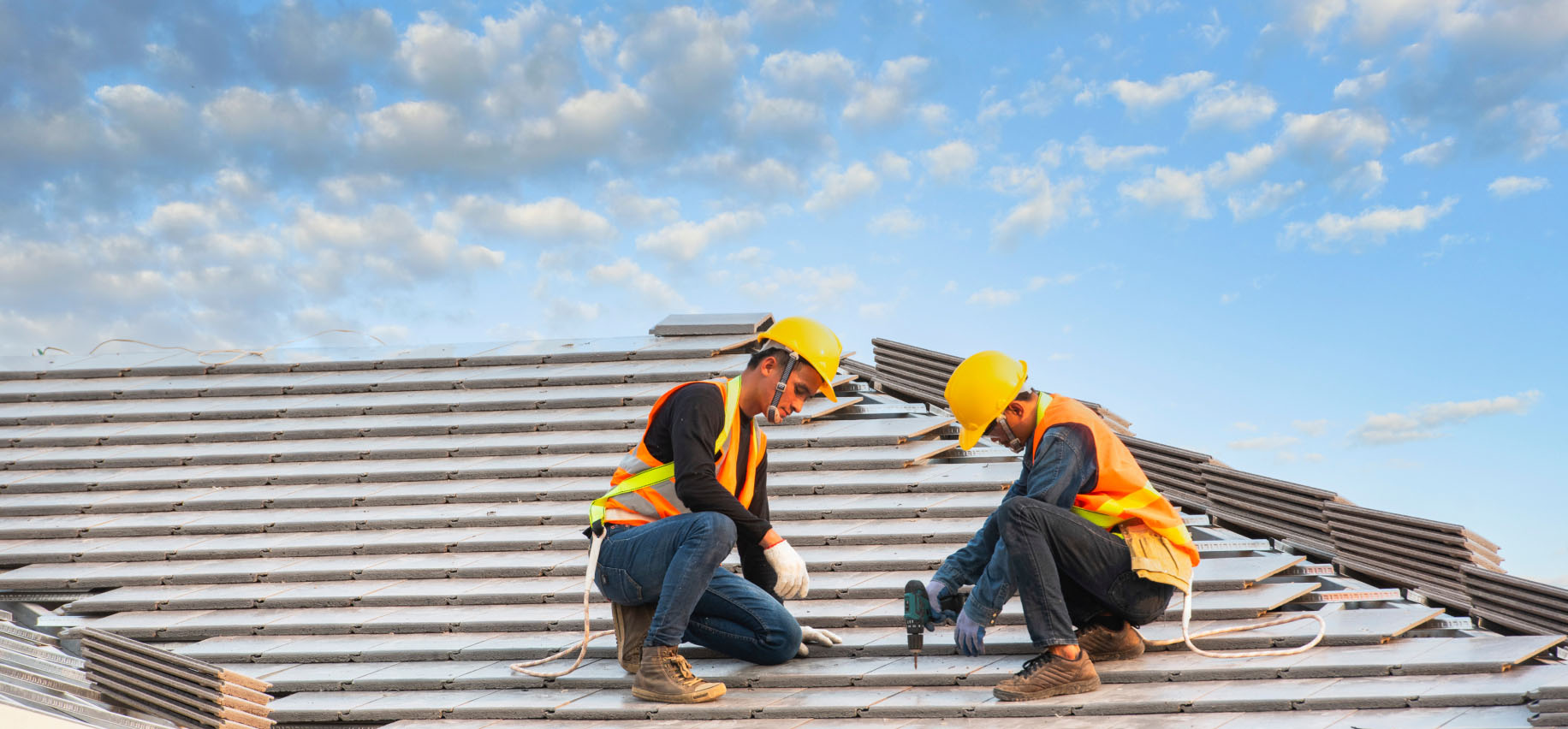 workers on a roof image